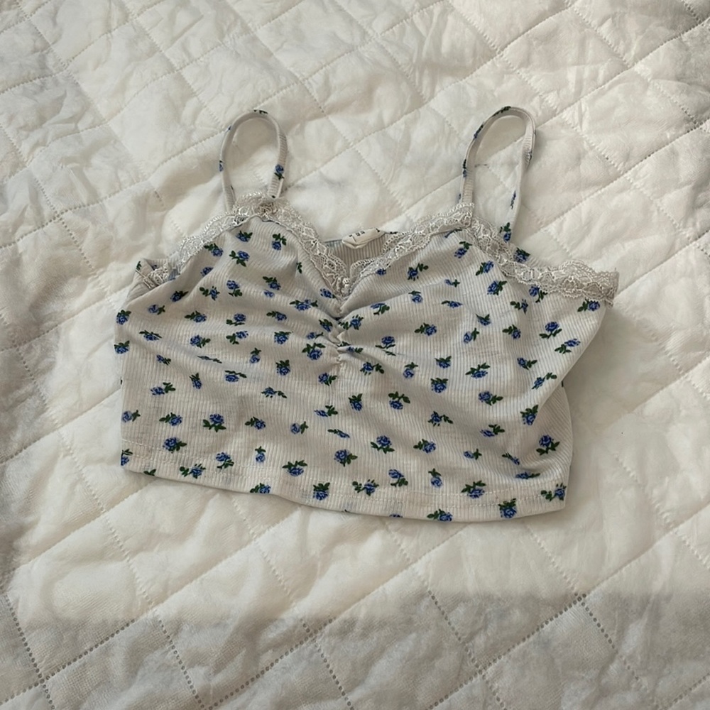She in shirt with blue flowers and lace